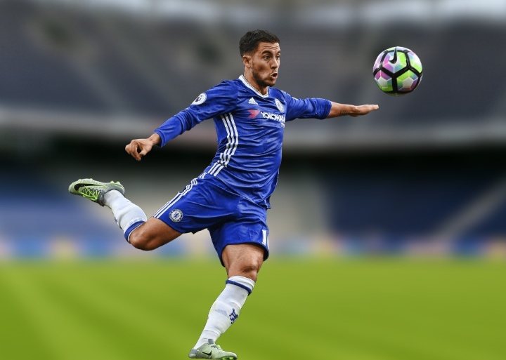 fc chelsea player in a blue jersey shooting a soccer ball