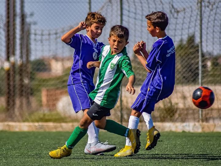 boys playing a soccer game boys playing a soccer game