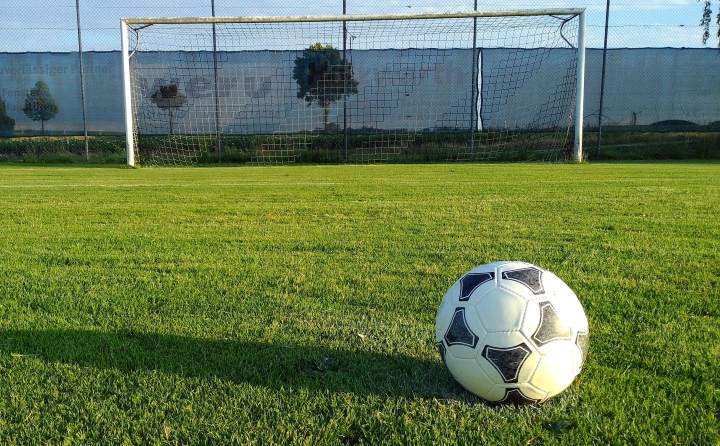soccer goal soccer goal and ball on green outdoor pitch