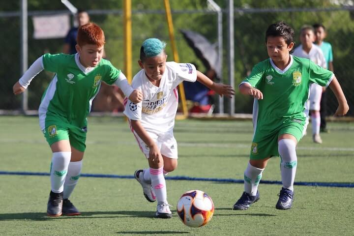 soccer-youth-players-battle-for-the-ball-during-a-match