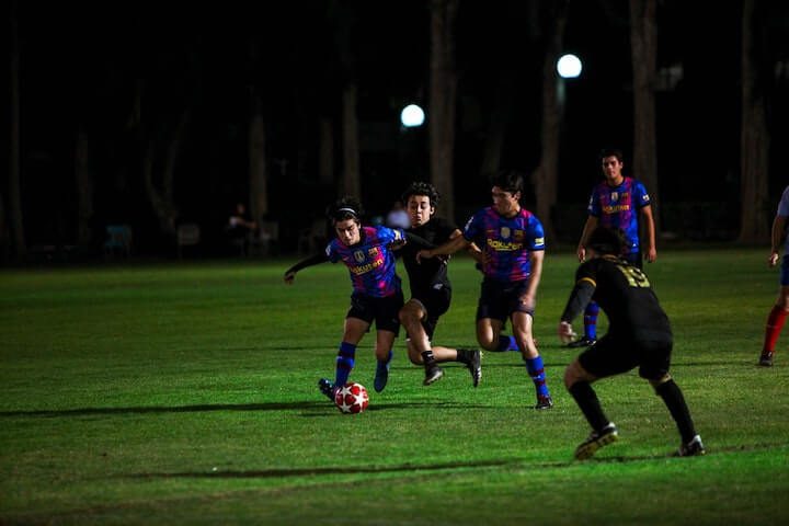 soccer-players-fight-for-poession-during-a-match