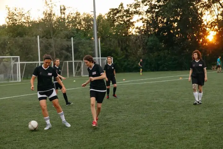 female-soccer-team-doing-drills-during-practice