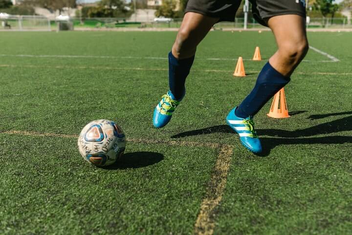 soccer-player-practices-individual-drills-dribbling