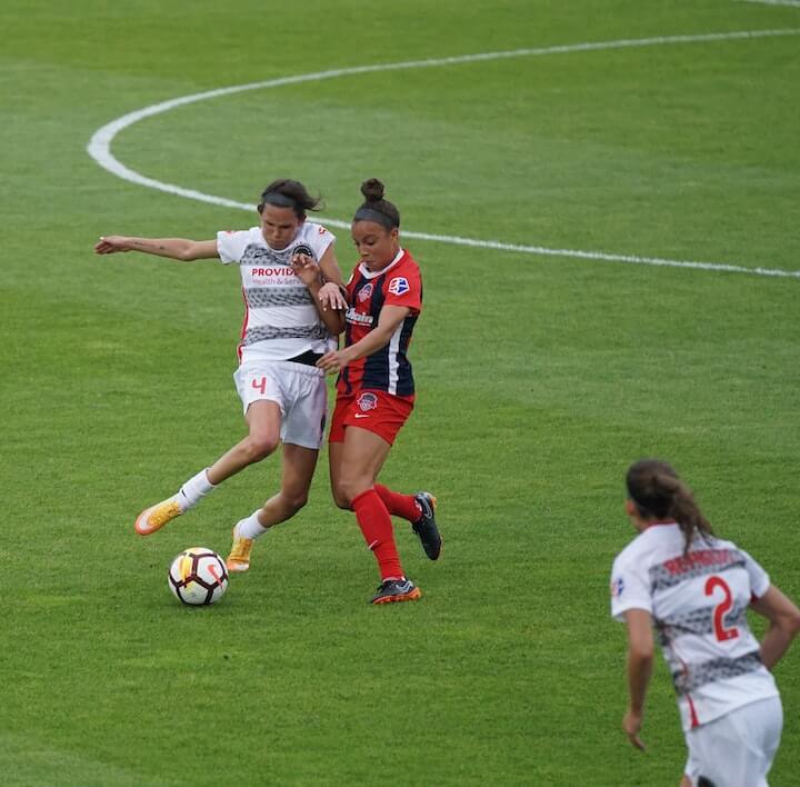 number-6-in-soccer defensive-midfielder-plays-1-v-1-against-the-attacker-during-a-soccer-match