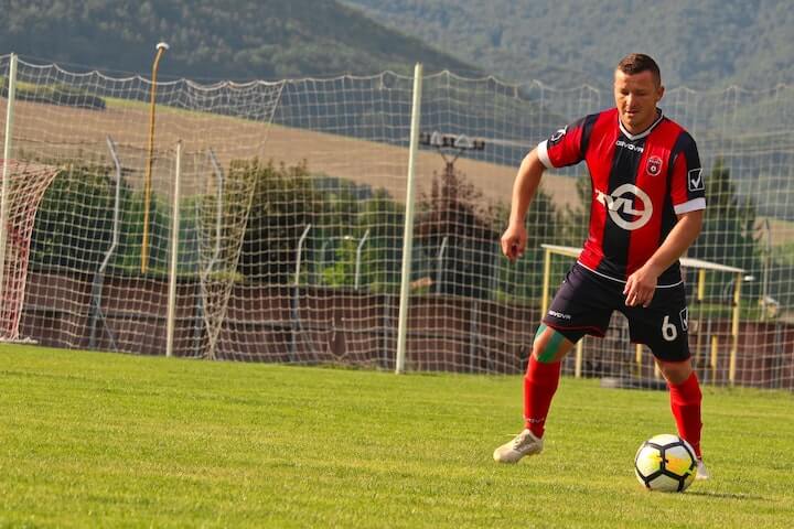 number-6-in-soccer the-number-6-in-soccer-team-pushes-the-ball-during-a-match