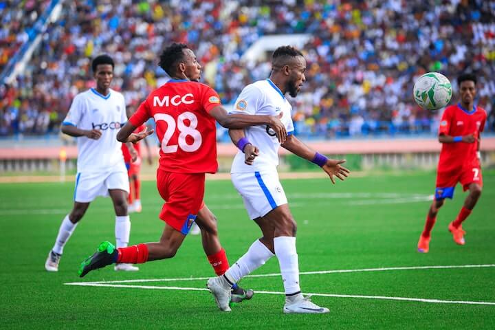 soccer striker soccer player looks to score a goal