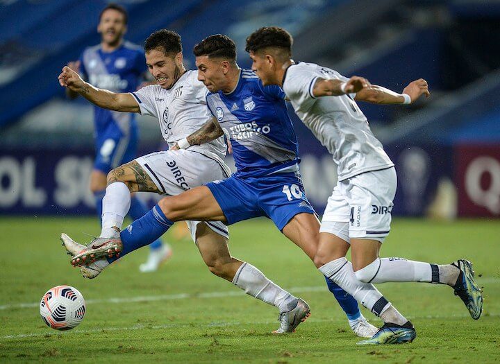 soccer player fights for the ball in a 3-4-2-1 formation